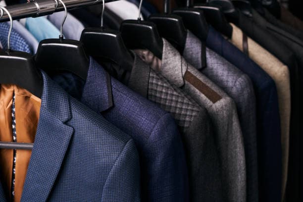 Tailored suits on hangers